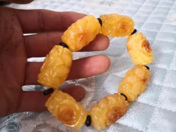 

Amber wax, beeswax, beads,Carved flower beads and elastic Bracelets
