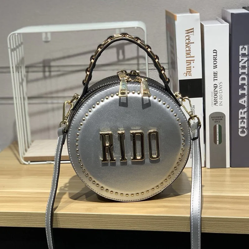 

2019 Spring and Summer New Wide Shoulder Strap Letter Rivet Small Round Bag Fashion Women Purse and Handbags