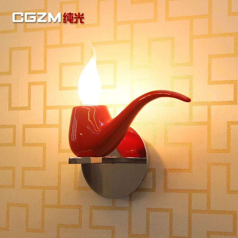 

A modern minimalist fashion creative living room bedroom bedside lamp wall lamp wall lamp resin decoration aisle