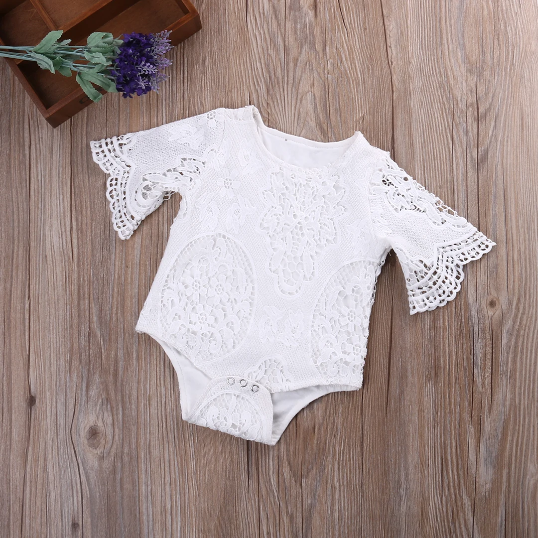 white ruffle baby romper