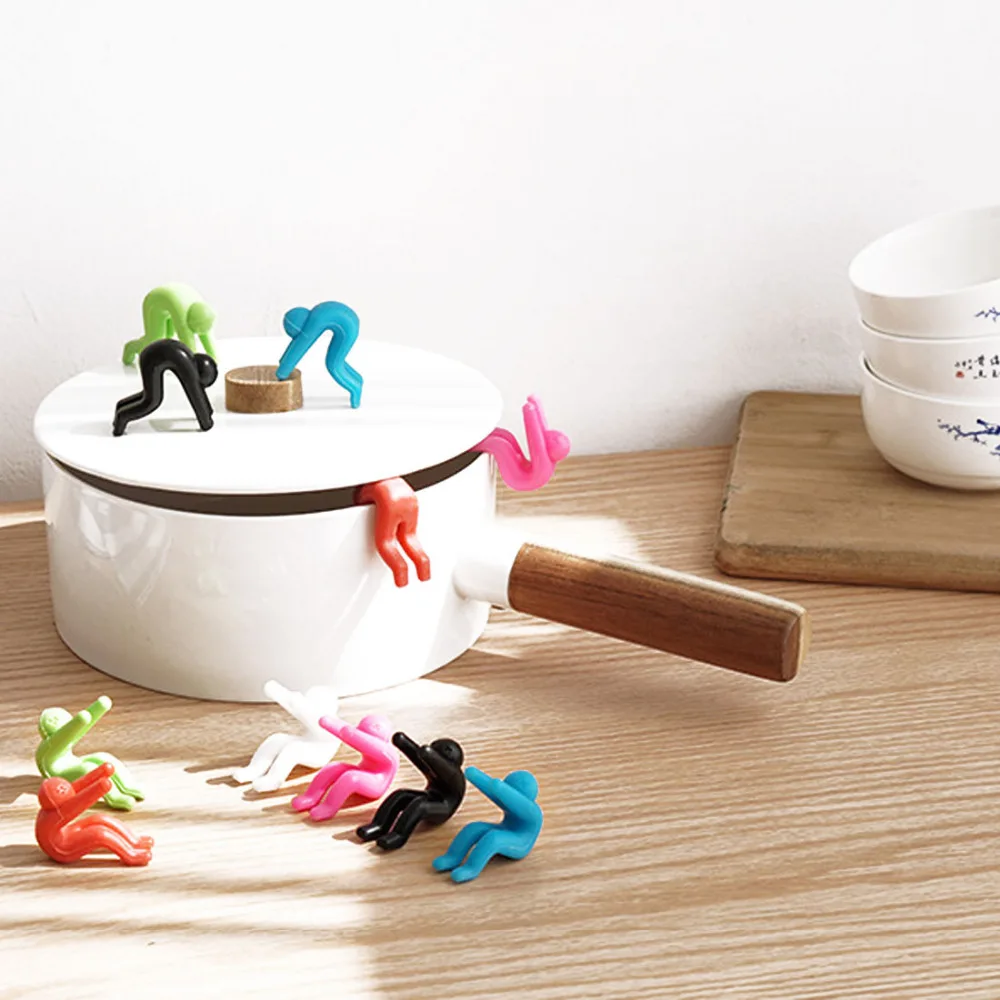 

2pcs/lot Silicone Pot Cover Heightening Prevent Spill Control Creative Cooking Tools Lid Holder Lilliputian Little people
