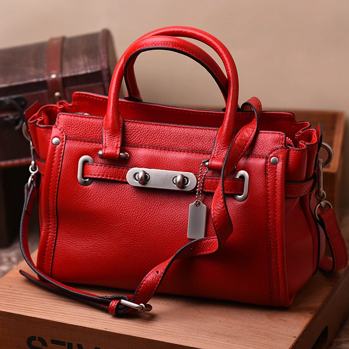 

The spring and summer of 2016 European and American fashion candy head layer grain leather portable shoulder diagonal wings leat