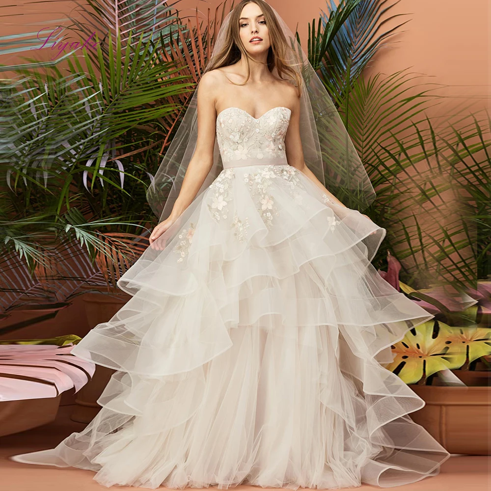 

Liyuke 2019 Married Ball Gown Wedding Dress Lace Flower Appliques Strapless Sash Bowknot Layered Customized