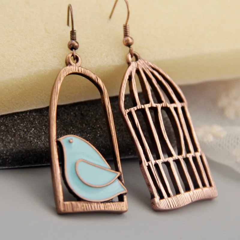 

Retro Antique Bohemian Asymmetric Filigree Bronze Green Hollowed Birdcage Fringed Earrings Female Personalized Earrings