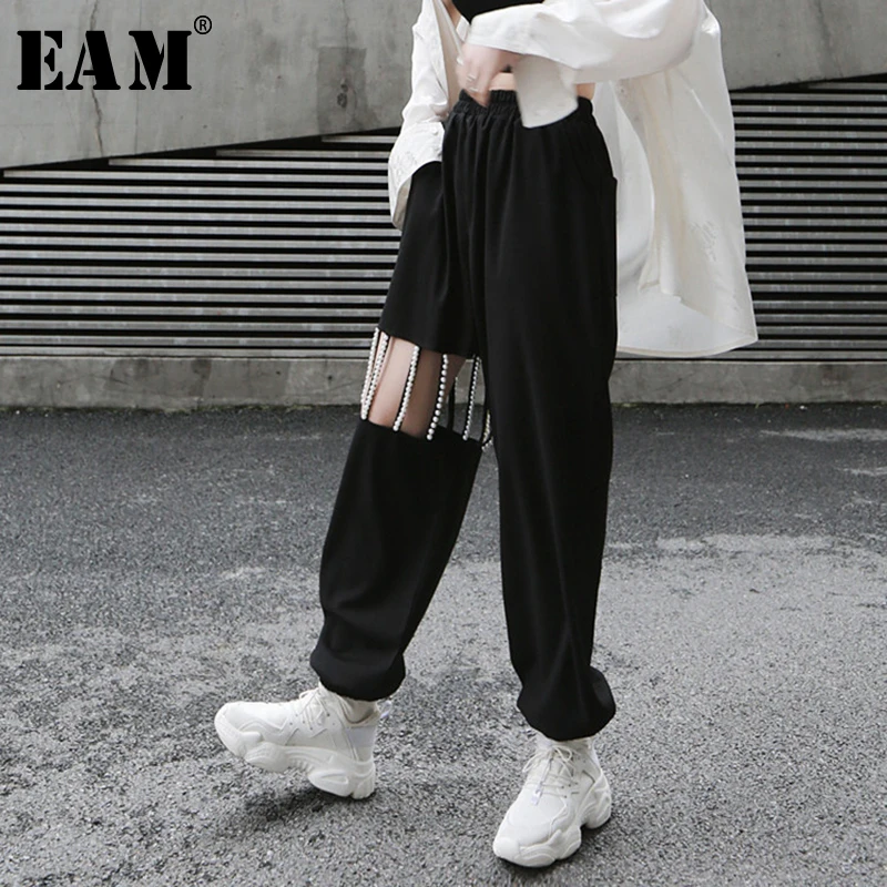 [EAM] новые весенне-осенние длинные штаны с высокой эластичной резинкой на талии, украшенные жемчужинами, с прорезями и карманами, женские модные брюки JY775