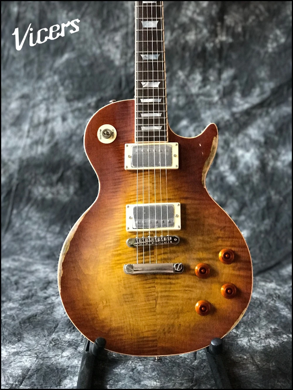 

Best Price Top Quality electric guitar with relics old by hand , one piece body and neck, Tune-o-Matic bridge , frets end bindin