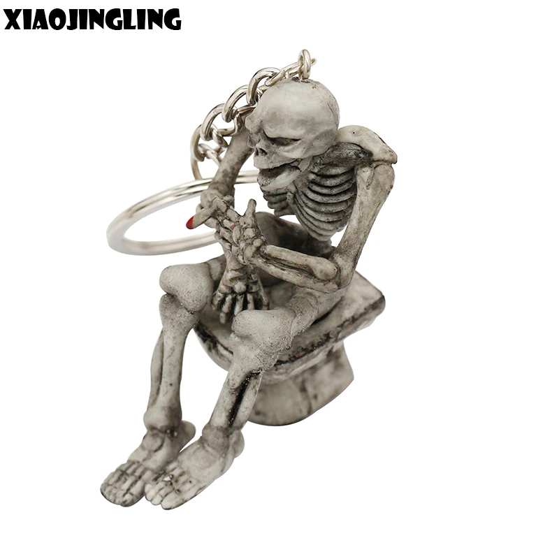 

XIAOJINGLING Fashion Jewelry Men Women Boys Girls Keychains Toilet Skull Skeleton On Commode Rubber Keyring Charms Car Keyfob