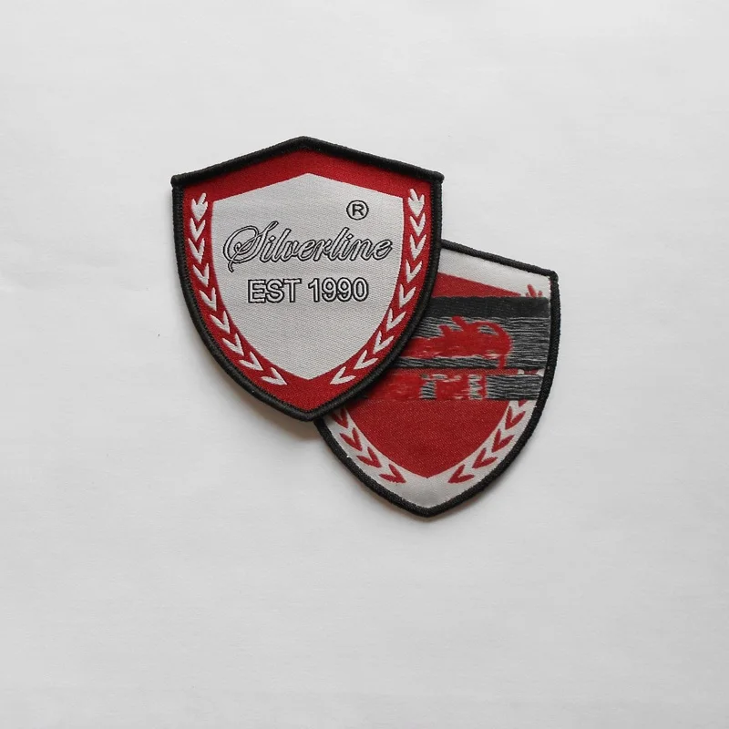 

customized (1000pcs/pack) garment iron on woven badges, shield stitched merrow border with brand logo for Africa schools