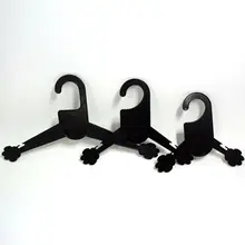 New fashion clothes dogs and cats in pet shops special racks with plastic hanger