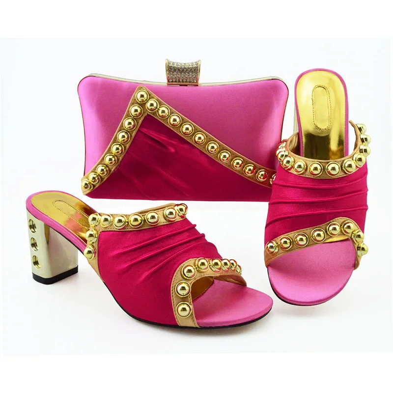 fuschia pink shoes and matching bag