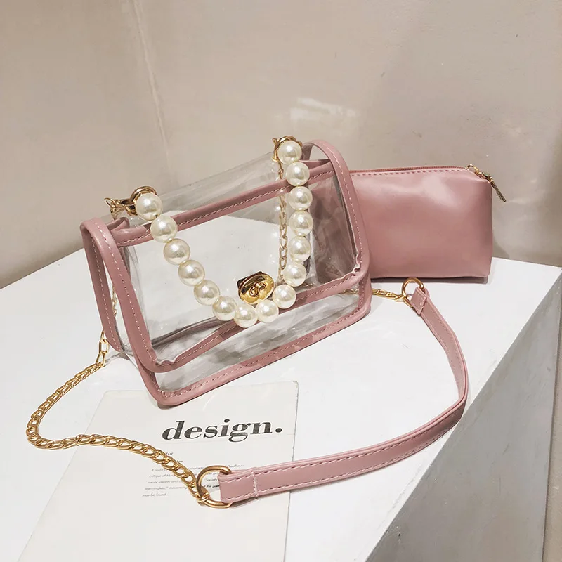الفاخرة مصمم Crossbody أكياس شفافة PVC النساء حزمة تألق سلسلة حقيبة كتف الإناث أعلى-حقائب بيد مع اللؤلؤ الفاخرة مصمم Crossbody أكياس شفافة PVC النساء حزمة تألق سلسلة حقيبة كتف الإناث أعلى-حقائب بيد مع اللؤلؤ