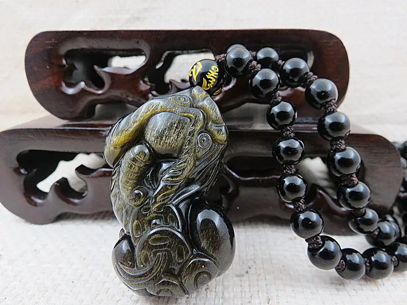 

AAAAA natural hand-carved three-dimensional unicorn gold Obsidian pendant 35%