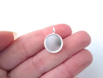 

Silver 12mm bezel settings (pick with our without matching glass cabochons) B162theof