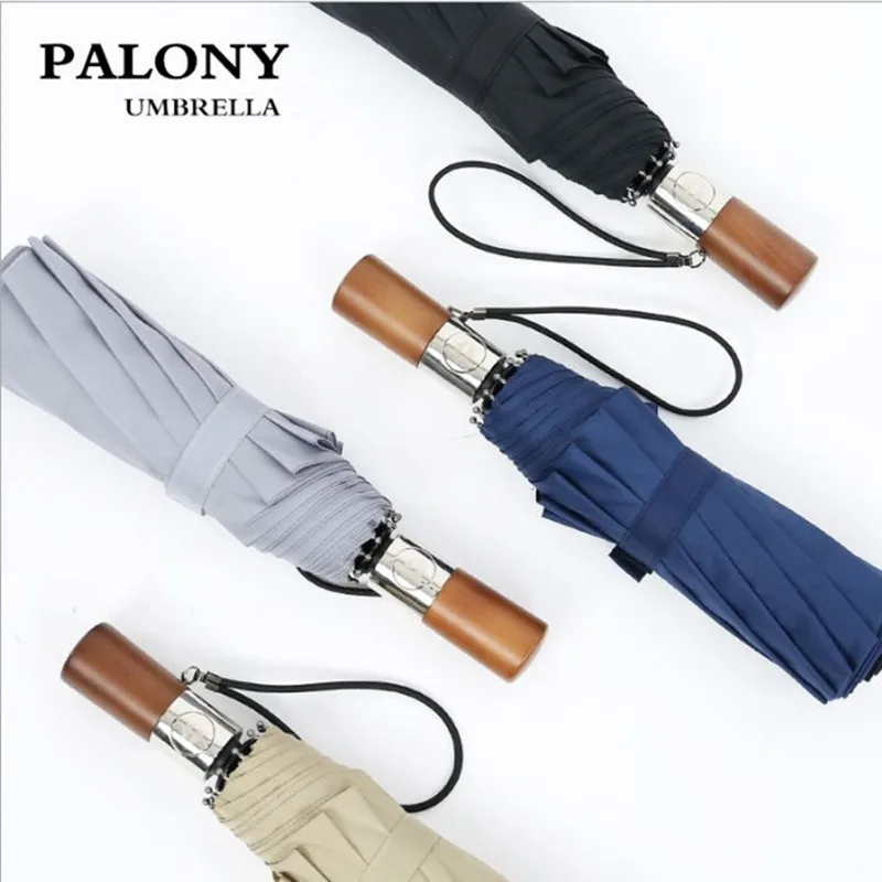 

Solid wood handle automatic umbrella three fold folding ten bone automatic umbrella one key to open custom windproof umbrella.