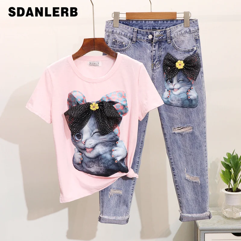 

Spring Summer 2019 New Drill-in Cartoon Cat Short-sleeved T-shirt + Hole Nine-cent Jeans Suit Women's Two Piece Sets Outwears