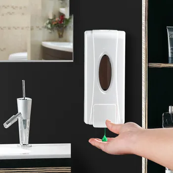 

Soap Dispenser In the hotel bathroom, plastic wall-mounted manual shower gel bottle is used as soap dispenser and hand sanitizer