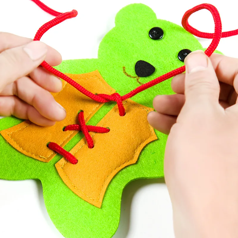 

Non-woven hand-made teaching aids/ thread-wearing clothes/ teddy bear wearing shoelaces/ puzzle game material kit