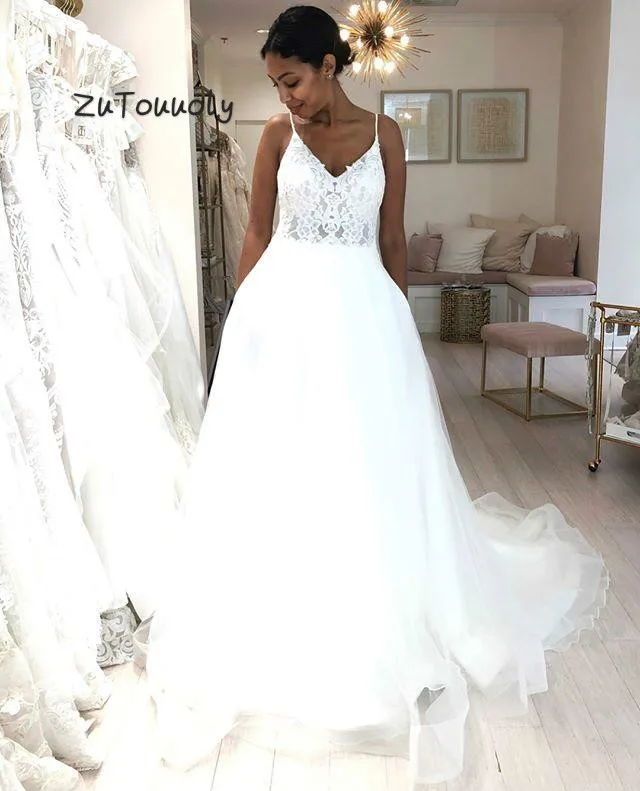 Descuento Caliente Vestido Novia Africano Blanco Tirantes Espagueti Tul Vestidos De Novia Bohemia De Talla Grande Espalda Descubierta Playa Vestidos De Novia Con Boton De Encaje May 2020