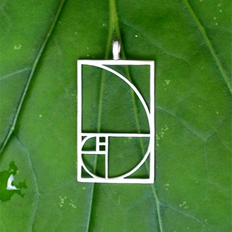 Прямая поставка подвеска Fibonacci с золотым соотношением черного/серебряного цвета