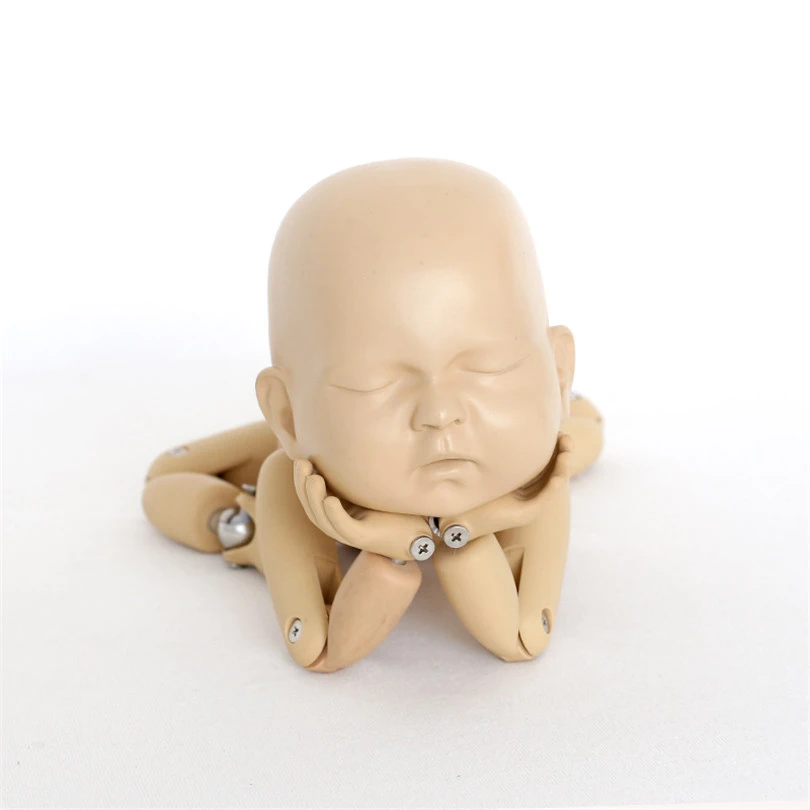 newborn photography posing doll