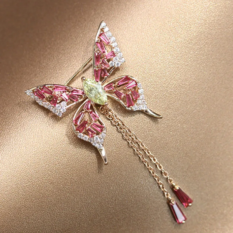 

Zlxgirl copper Shape Pink Butterfly brooches Women Gold Color What Drop Tassel Classic Wedding Decoration Animal Corsage Pins