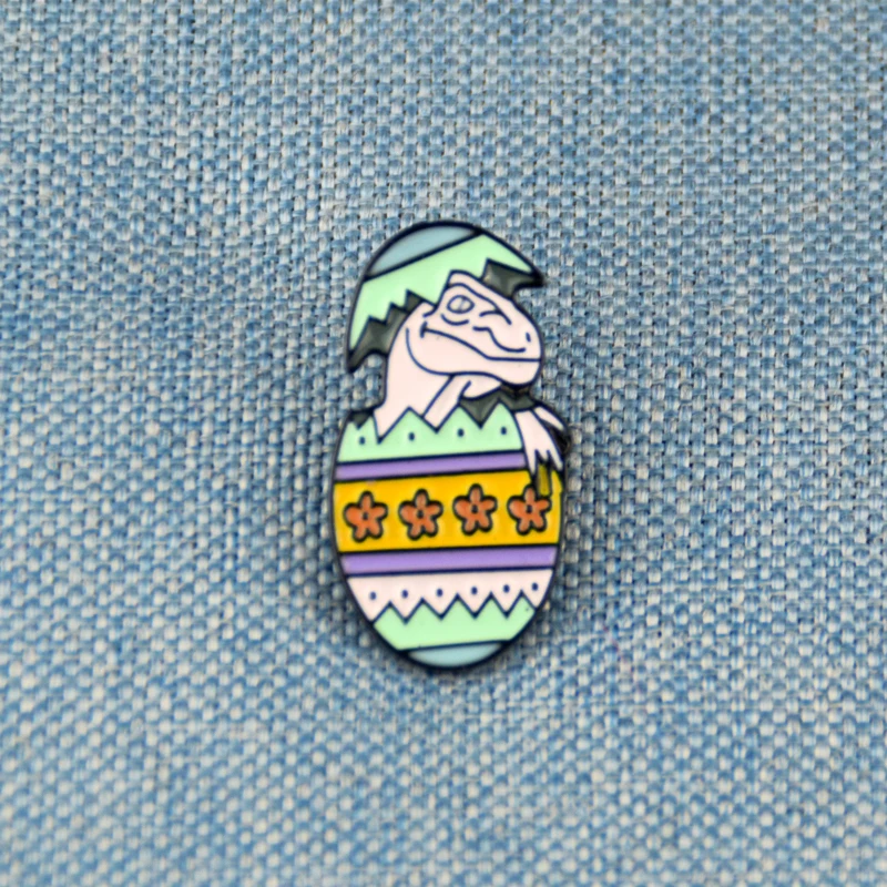 

Easter egg dinosaur enamel pin badge broken out dinosaur eggs
