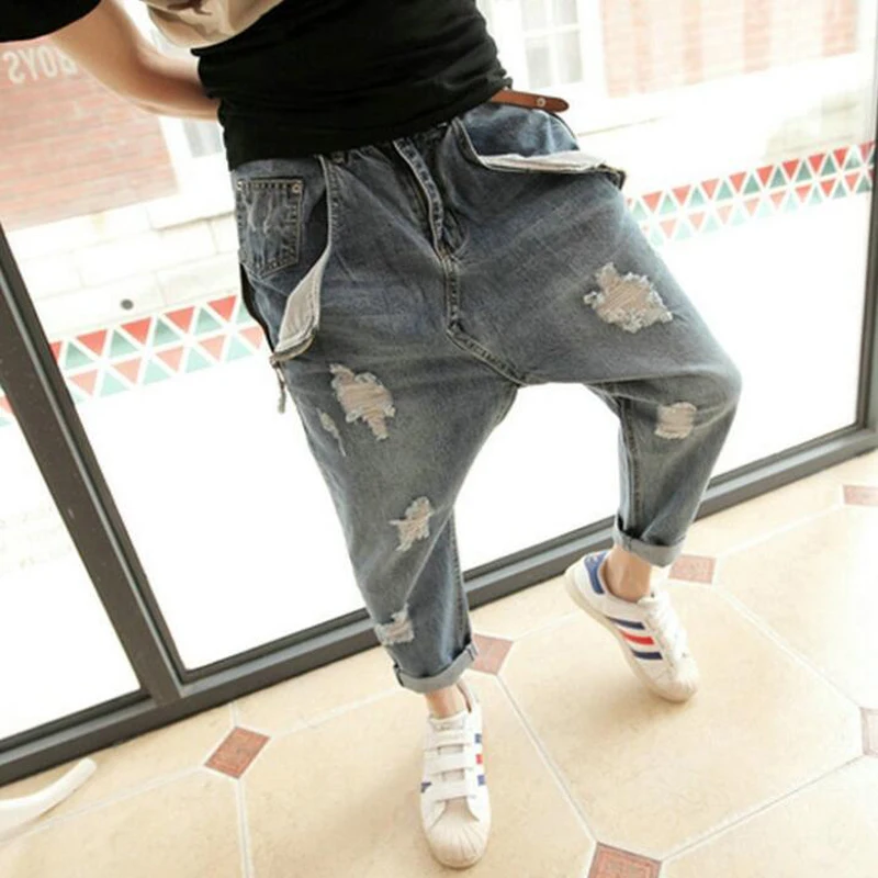 Personality hole jeans male plus size harem pants male low rise pants skinny pants hanging crotch