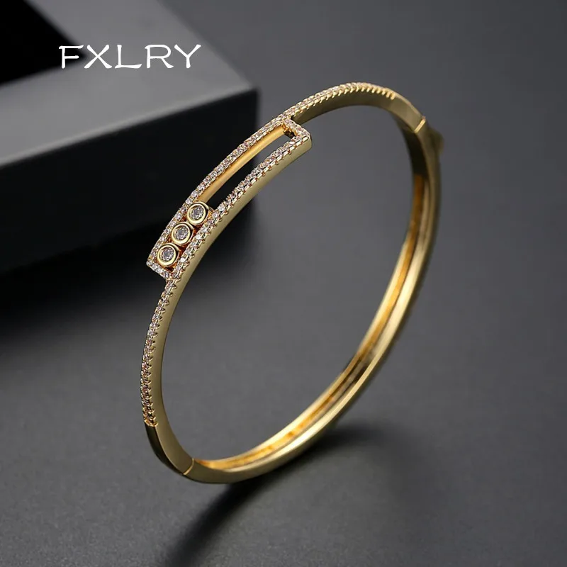 

FXLRY New Design Shiny Asymmetric Bracelets&Bangles For Women Charming Tiny CZ Paved Fashion Gold Color Bangle Jewelry