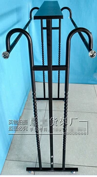 Clothing store display shelf. Console, wrought iron clothes frame. The parallel bars hangers.
