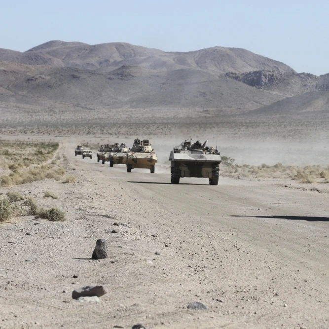 Convoy of military vehicles traveling in Fort Irwin  California Poster Print (17 x 11)
