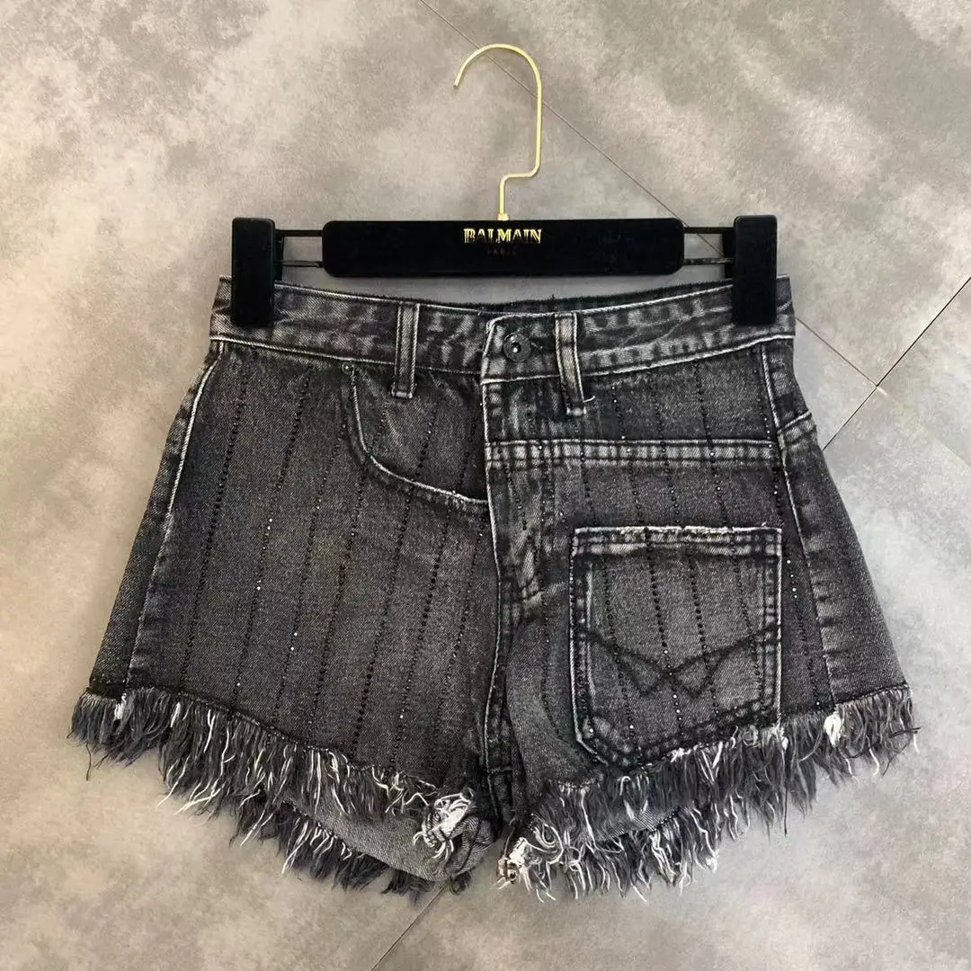 

2019 spring new high-temperature hot drilling raw edge pocket decoration trend denim shorts female