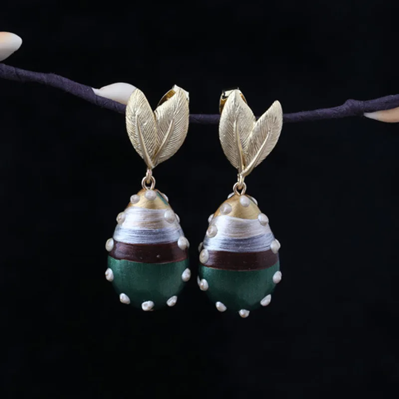 

The designer painted glazed vase style earrings