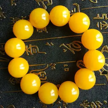 

TNUKK Natural chicken oil yellow honey wax primitive stone men and women's bracelet. The Baltic ore is not optimized .