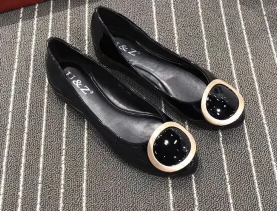 black flats with gold trim