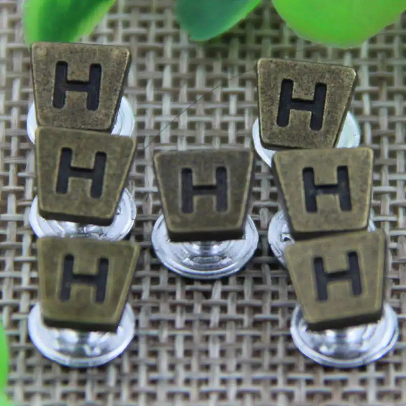 

DoreenBeads Zinc Alloy Garment Rivet Trapezoidal Shape Letter Costume Bag Hat Shoes Jacket Coat Jeans Deco Accessory 100Sets
