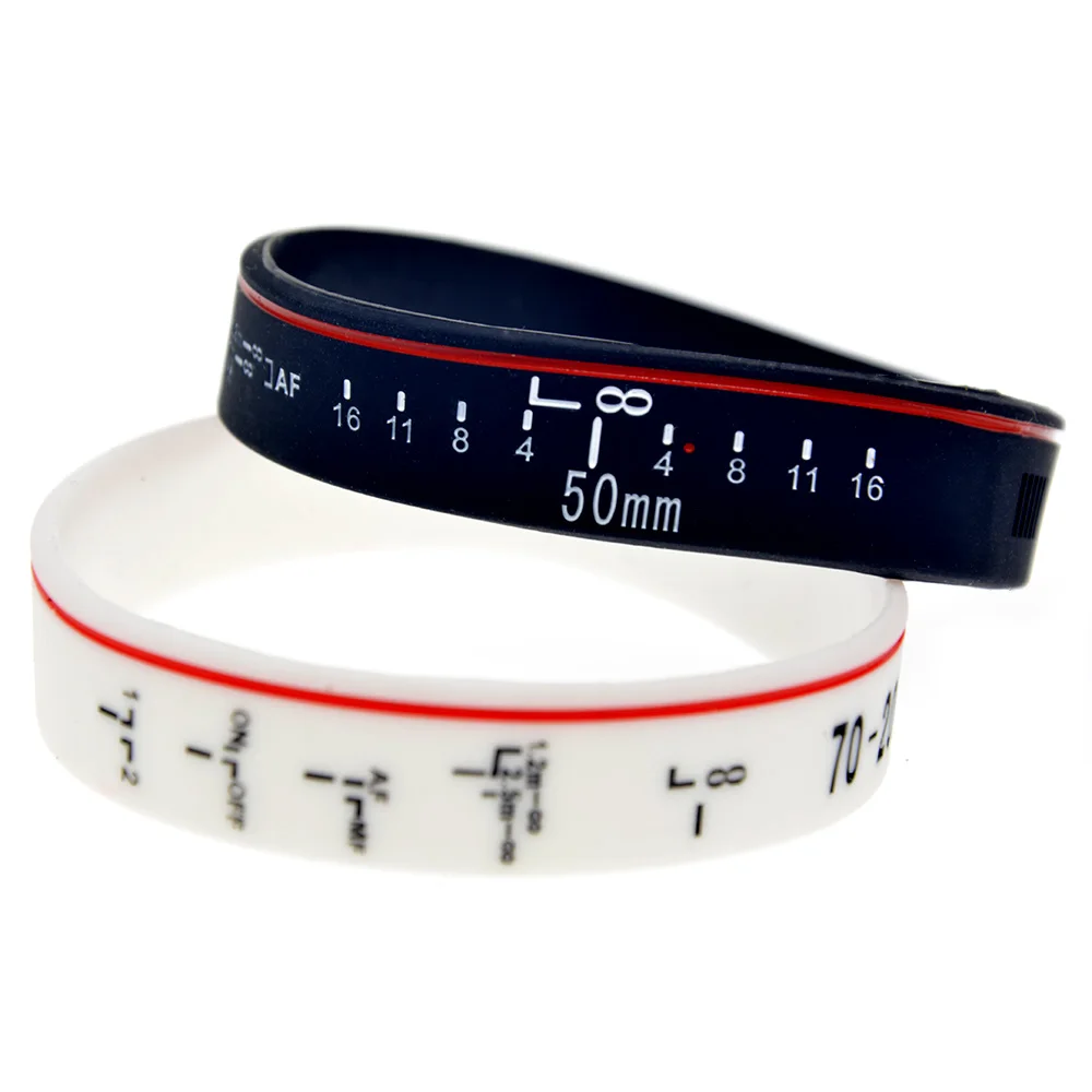 

OneBandaHouse 1PC Ink Filled Logo Focus the Lens Silicone Bracelet Decoration Wristband