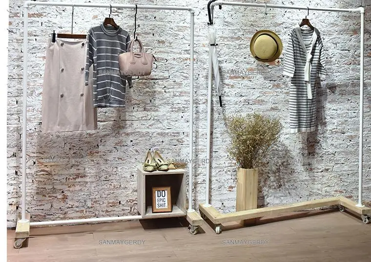 Clothing store display rack. Clothes rack women's shop floor-to-floor hangers. Solid wood Textile Gondola simple white gantry.