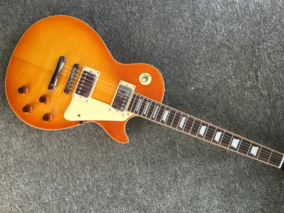 

Honey Burst electric guitar with One Piece Body, One Piece Neck, Tune-o-Matic bridge and cream body& frets end binding guitarra