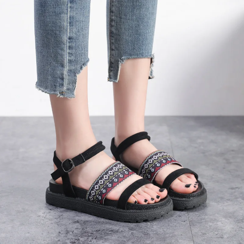 

Fashion new word buckle open toe Harajuku sandals female summer flat bottom wild Korean sandals.