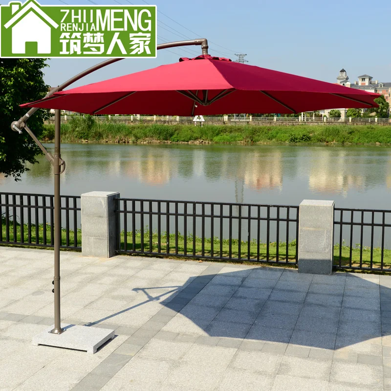 A outdoor umbrella patio banana hand side of hotel circular booth