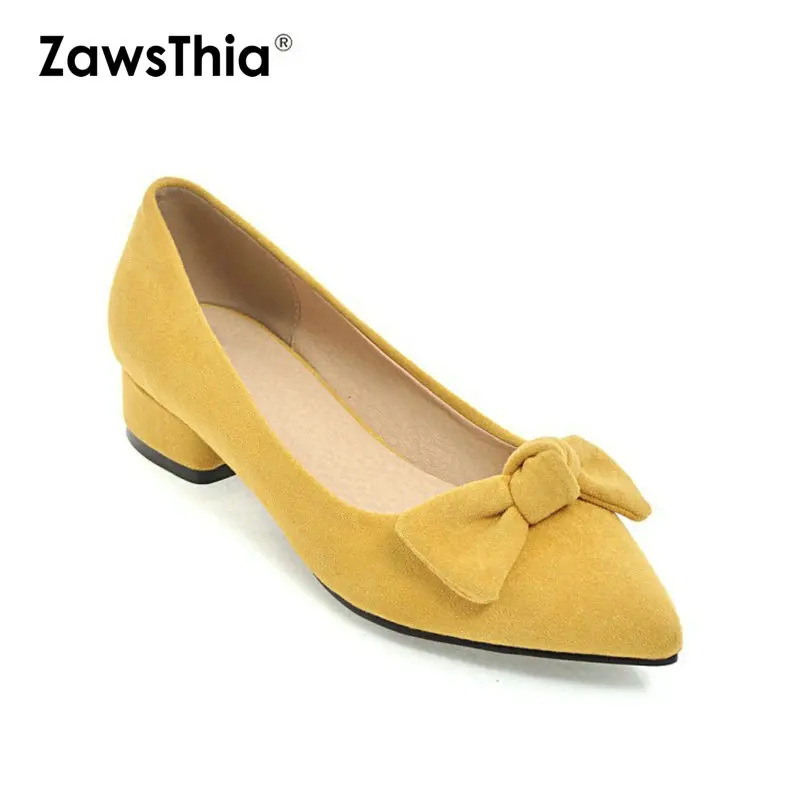 yellow and black pumps