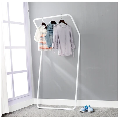 Display stand. Colorful floor against the wall. Hanger. Clothing. Clothes tree.