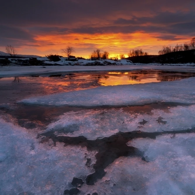 A fiery sunrise over Lavangsfjord  Troms  Norway Poster Print (34 x 22)