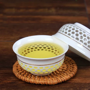 

6 pcs/set 40ml Chinese jingdezhen Ceramic tea cup Creative honeycomb Hollow Out pervious to light from Jingdezhen Ceramic Teacup