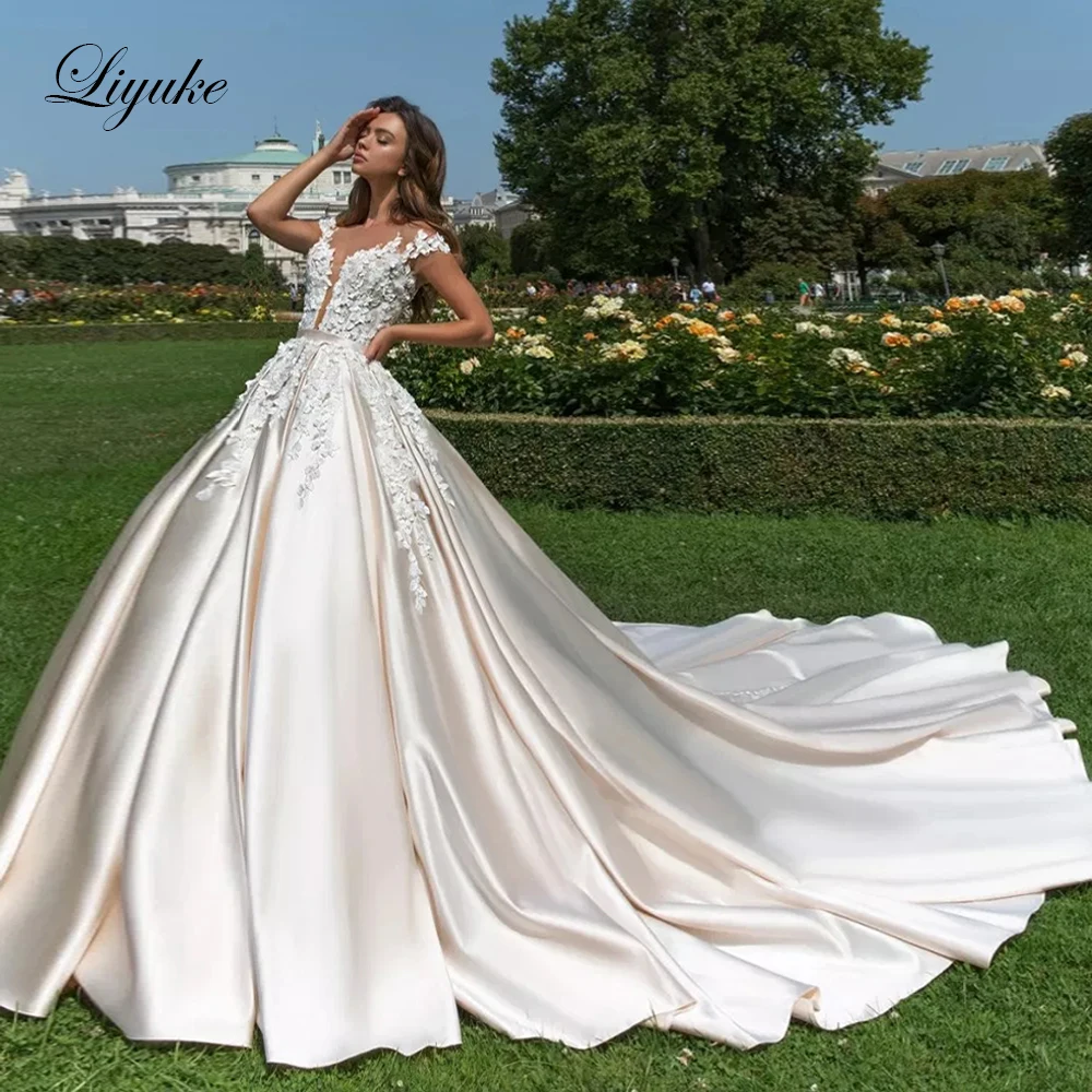 

Liyuke Champagne Satin A-Line Wedding Dress V-Neckline With Short Sleeve Chapel Train Wedding Gown