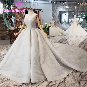 

2019 Sexy Sheer Jewel Neck Ball Gown Wedding Dresses Crystals Ruffles Appliques Illusion Glitters Plus Size Beads Wedding Gown