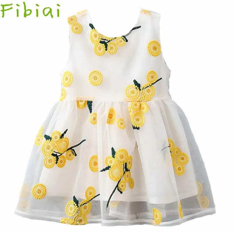 white sundress with yellow flowers