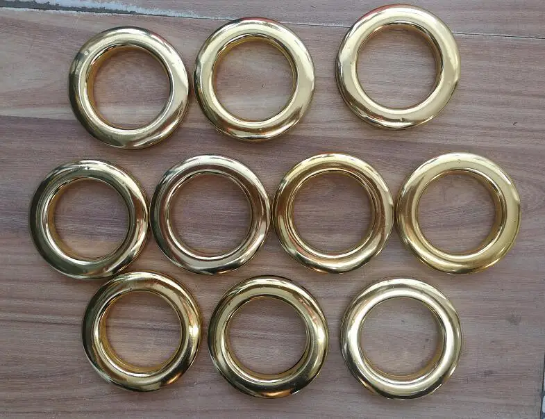 

Factory Supply 10pcs x 42mm Shiny Gold color Plastic Curtain Eyelets and Rings Clips Grommets