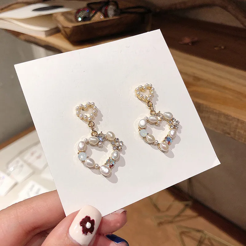 

Dominated The new 2019 fashion temperament hollow heart crystal personality long pearl Women Drop earrings creative