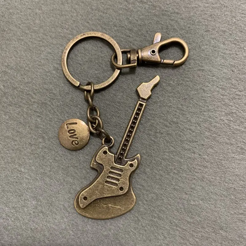 

Alloy Vintage Ancient Bronze Guitar Bass Key Rings Musical Instrument Braided Cowhide Keychain Pendant Gift For Friends 1PCS